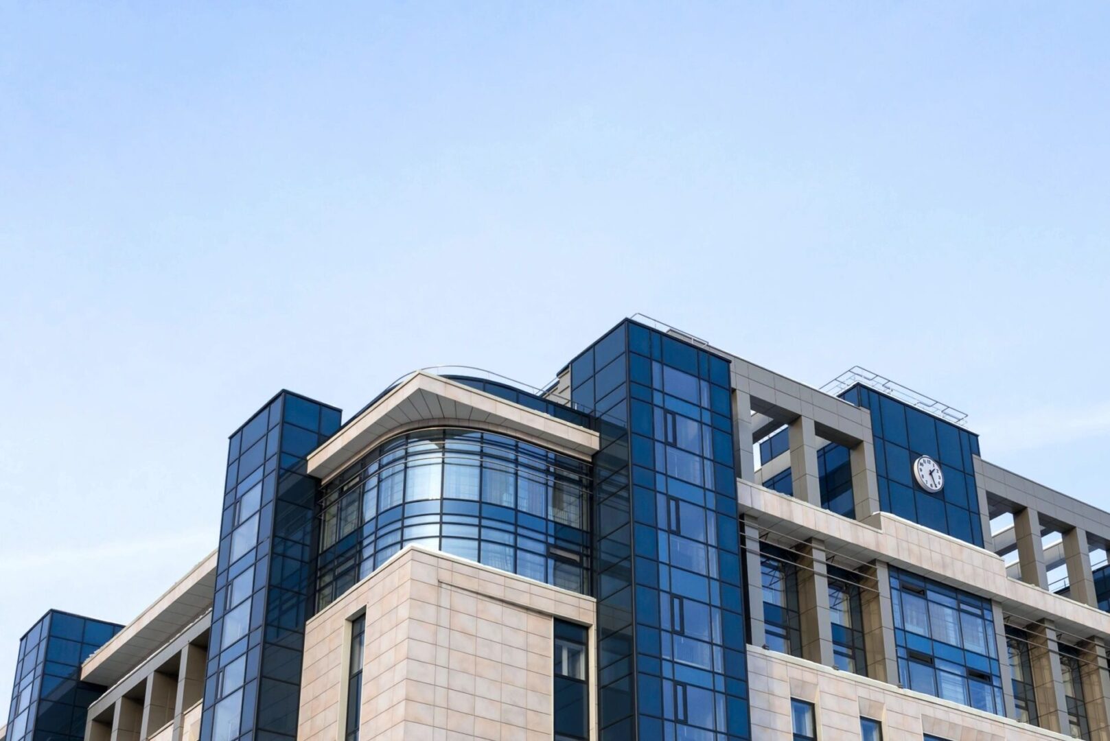 A building with many windows and a sky background